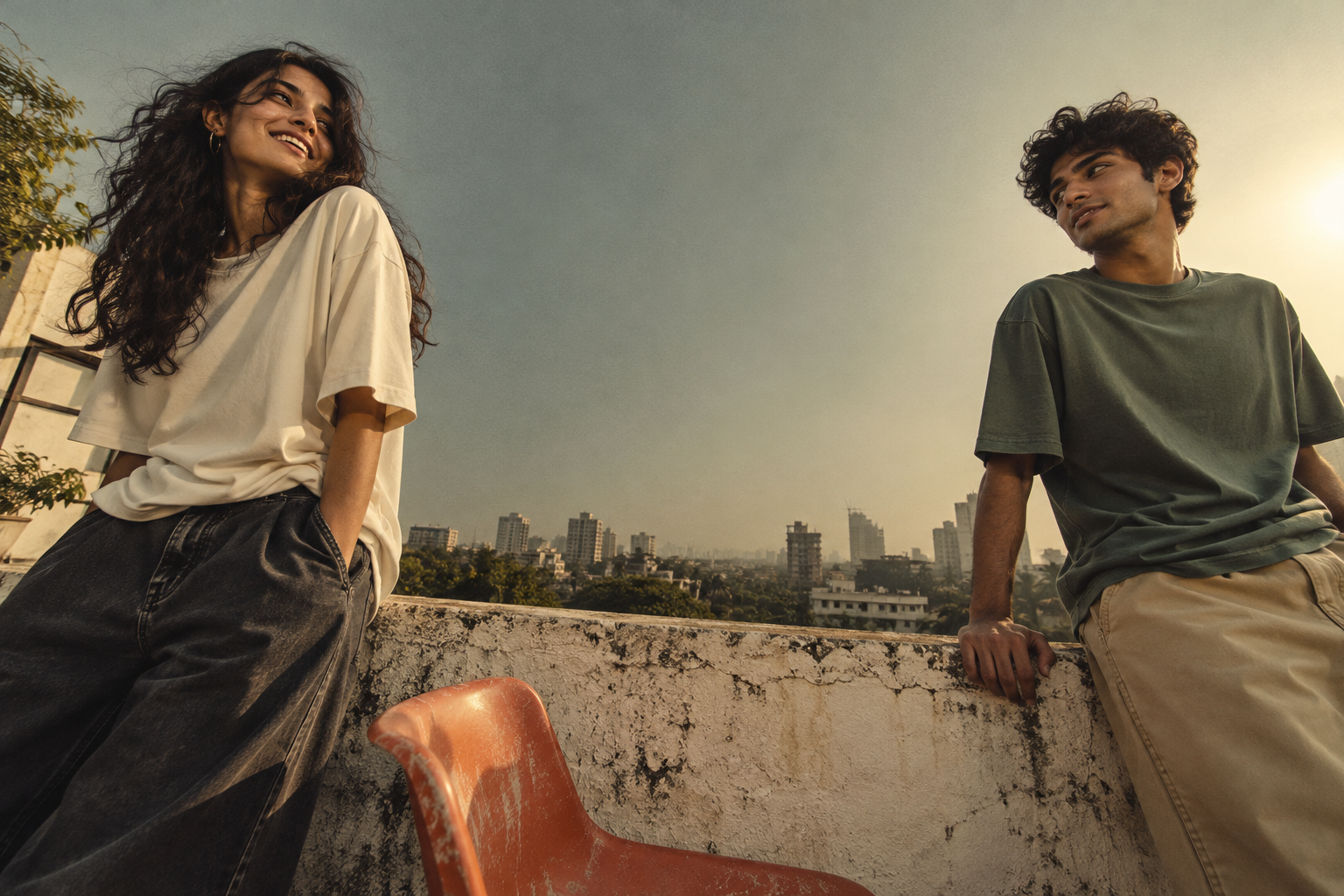 Two friends in relaxed tees on a sunlit rooftop, an LME campaign concept